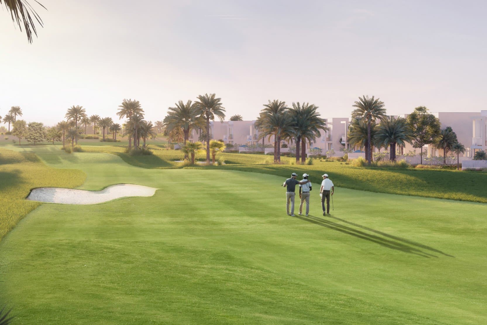 Golfers on the championship fairway at Emaar South, villas along the course